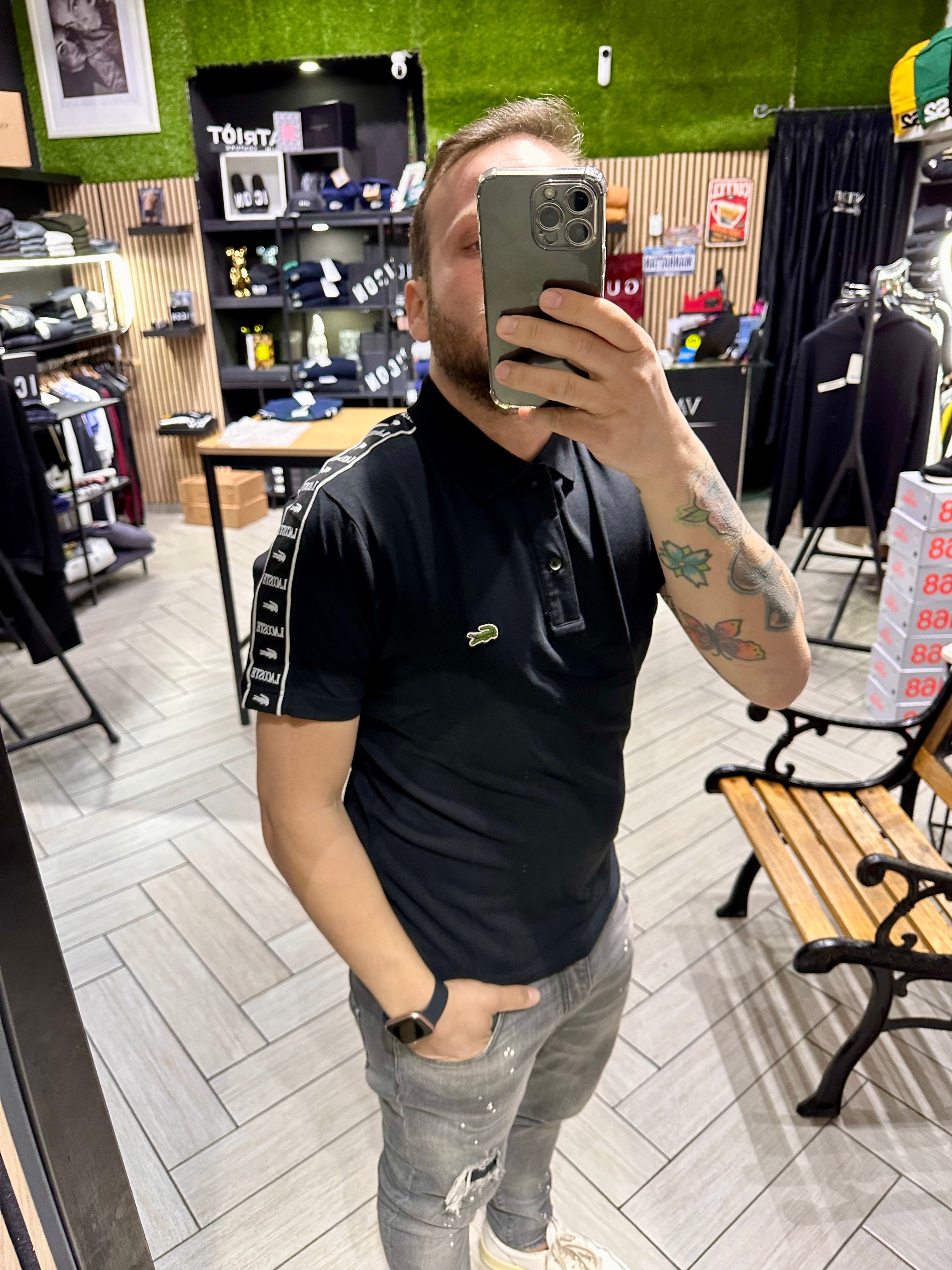 Polo Lacoste Nera con fasce