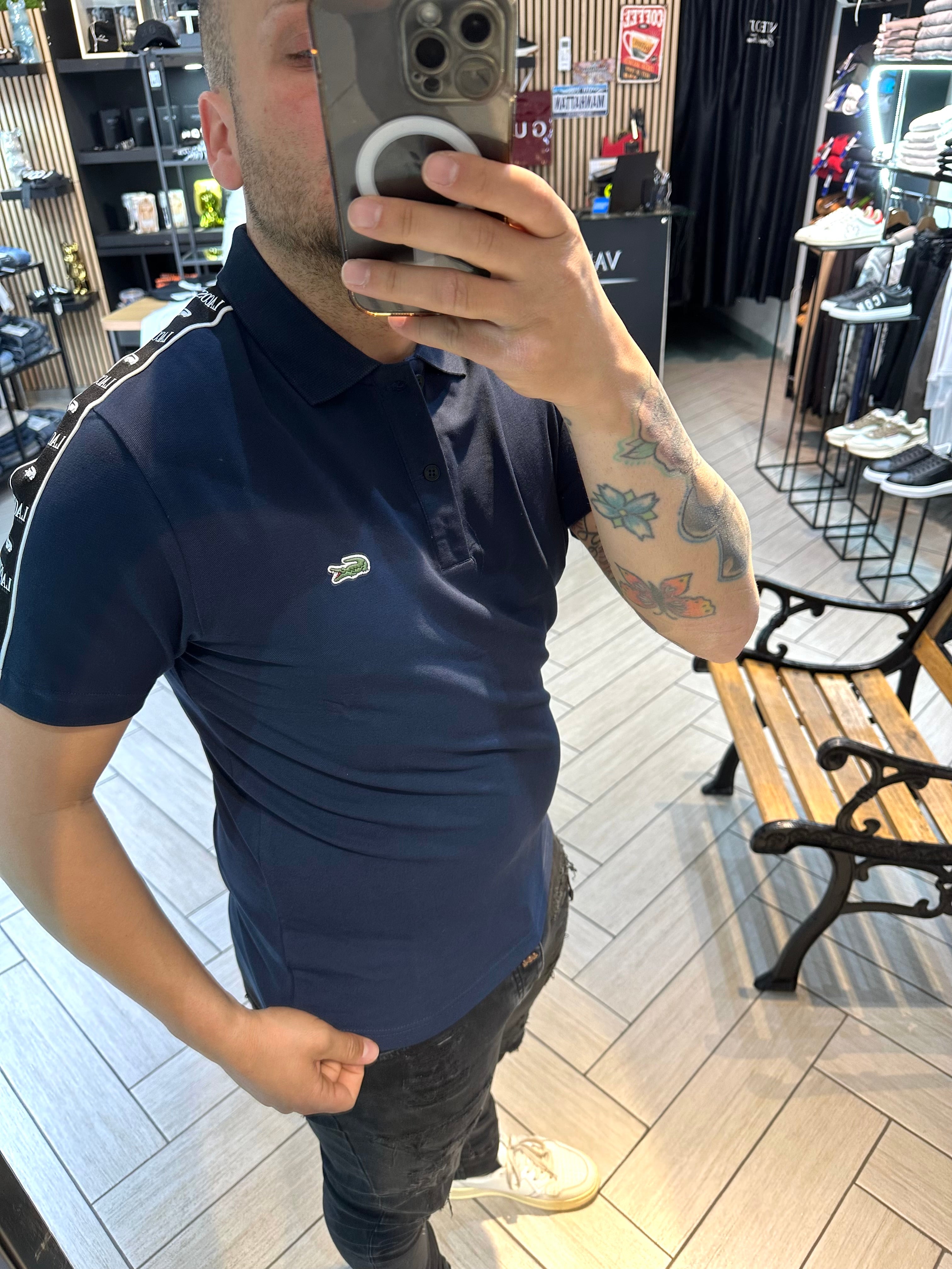 Polo Lacoste con fascia blu
