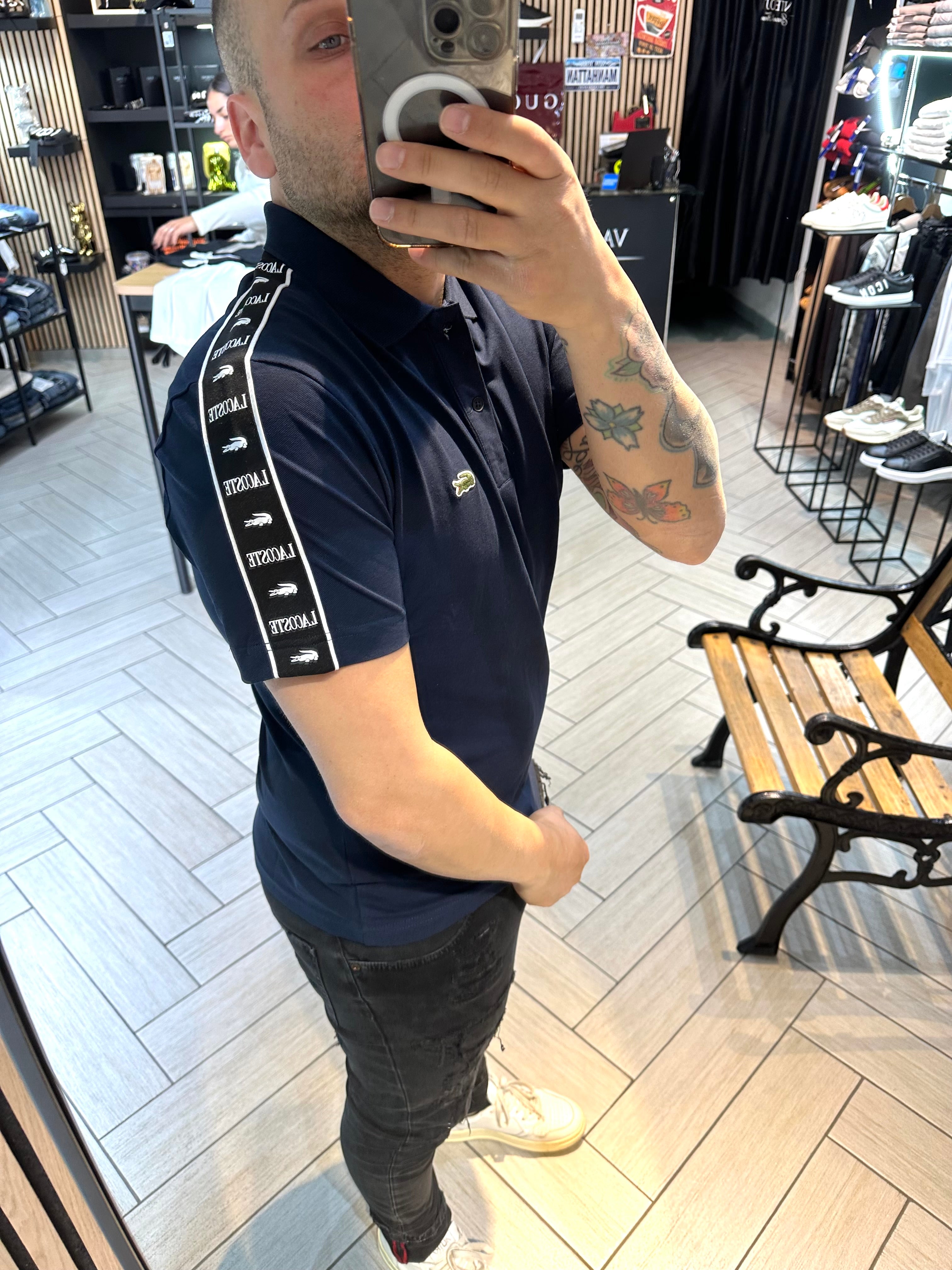 Polo Lacoste con fascia blu