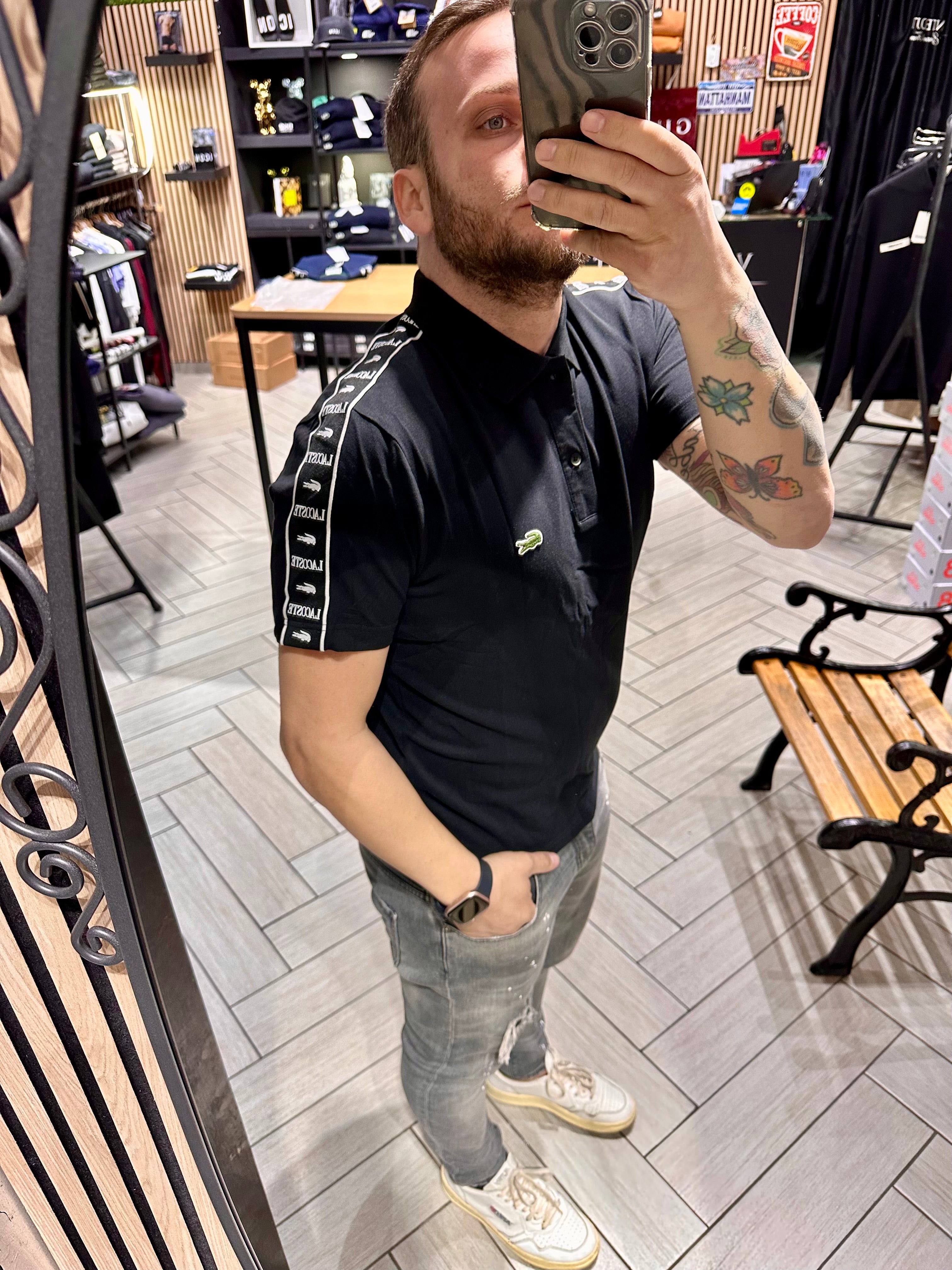 Polo Lacoste Nera con fasce