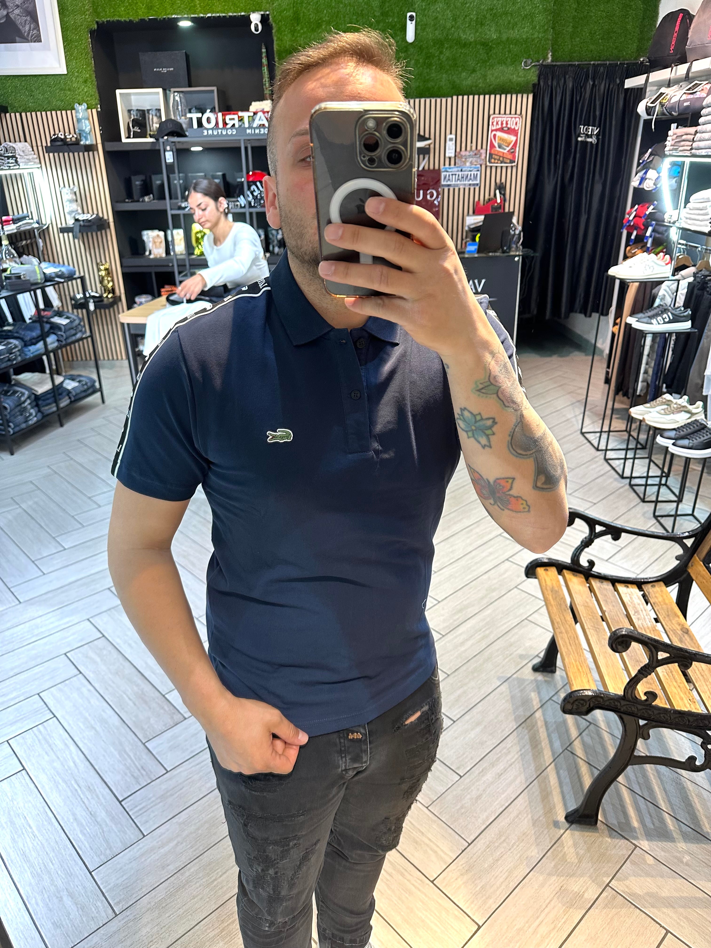 Polo Lacoste con fascia blu