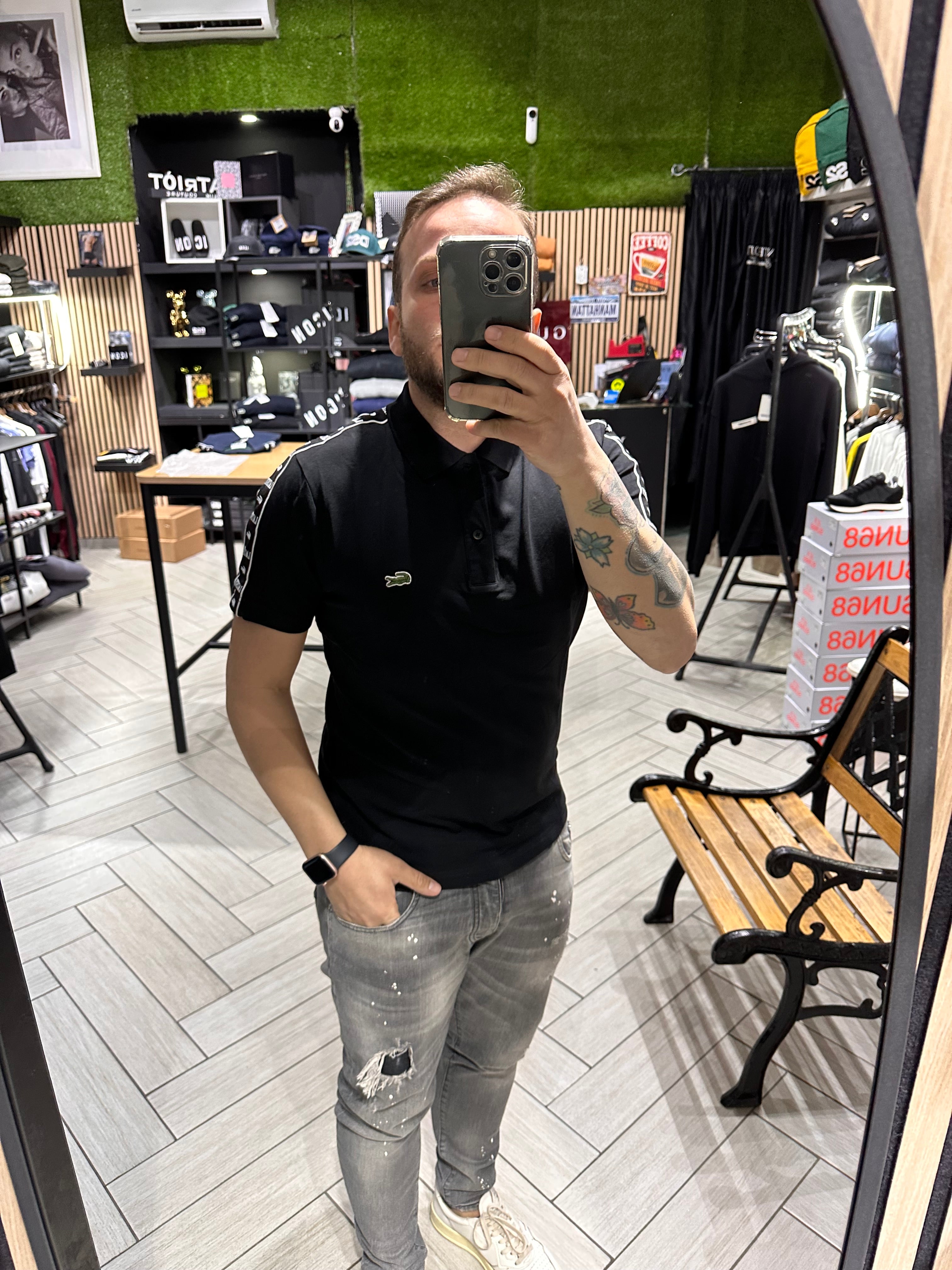 Polo Lacoste Nera con fasce